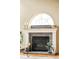 A decorative fireplace with stone accents, candles, and decor at 1210 Snowberry Ln, Broomfield, CO 80020