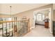Hallway view with staircase and entrance to the main bedroom at 1210 Snowberry Ln, Broomfield, CO 80020
