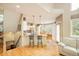 Open kitchen with breakfast bar, pendant lighting, stainless steel appliances, and adjacent dining area at 1210 Snowberry Ln, Broomfield, CO 80020