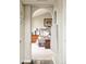 View of the main bedroom through an arched doorway at 1210 Snowberry Ln, Broomfield, CO 80020
