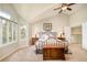 Comfortable main bedroom with vaulted ceilings, large window, and neutral tones at 1210 Snowberry Ln, Broomfield, CO 80020