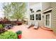 Outdoor patio featuring seating, chaise lounges, and a charming garden at 1210 Snowberry Ln, Broomfield, CO 80020