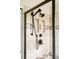 Modern shower featuring a dual shower head and tiled walls at 1210 Snowberry Ln, Broomfield, CO 80020