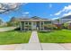 Charming single-story home with a well-manicured lawn and inviting stone accents near the entryway at 9901 E Evans Ave # 9A, Aurora, CO 80247