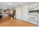 Bright living space showcasing the kitchen, closet space, and views into the living room at 9901 E Evans Ave # 9A, Aurora, CO 80247