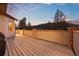 Spacious back deck with mountain views and wood flooring, ideal for outdoor entertaining at 21016 Horse Bit Way, Morrison, CO 80465