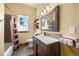 Bright bathroom with a modern vanity, stylish mirror, and bathtub with a patterned shower curtain at 21016 Horse Bit Way, Morrison, CO 80465