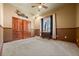 Bedroom with wood trim, large closet, and window providing ample natural light, complemented by soft carpeting at 21016 Horse Bit Way, Morrison, CO 80465