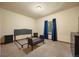 Cozy bedroom with plush carpeting, neutral paint, and a window that frames an outdoor view at 21016 Horse Bit Way, Morrison, CO 80465