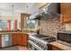 Gourmet kitchen with stainless steel appliances, professional gas range, and scenic views at 21016 Horse Bit Way, Morrison, CO 80465