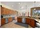 Spacious kitchen with custom wood cabinetry, granite countertops, stainless steel appliances, and stunning views at 21016 Horse Bit Way, Morrison, CO 80465