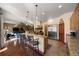 Open concept kitchen with counter seating and stainless steel appliances at 21016 Horse Bit Way, Morrison, CO 80465