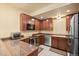 Basement kitchenette with stainless steel appliances, granite countertops, and ample cabinet space at 21016 Horse Bit Way, Morrison, CO 80465