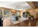 Bright living room with stone fireplace, sliding glass door and modern furnishings at 21016 Horse Bit Way, Morrison, CO 80465