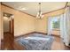 Inviting living room with hardwood floors, a decorative rug, and natural light filtering through the window at 21016 Horse Bit Way, Morrison, CO 80465