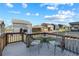 Inviting backyard deck featuring a cozy table and chairs, perfect for enjoying the neighborhood views at 2144 Rosette Ln, Castle Rock, CO 80104