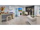 Cozy finished basement featuring a fireplace, TV, and seating area with a unique accent wall at 2144 Rosette Ln, Castle Rock, CO 80104