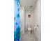 Bathroom with modern fixtures, tile floors, toilet, and shower/tub at 2144 Rosette Ln, Castle Rock, CO 80104