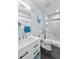 Modern bathroom featuring a vanity with chrome faucet, butterfly decor and a spacious glass-enclosed shower at 2144 Rosette Ln, Castle Rock, CO 80104