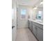 Bathroom featuring a double vanity and tile flooring offering comfort and convenience at 2144 Rosette Ln, Castle Rock, CO 80104
