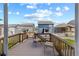 Relaxing backyard deck with a charming outdoor seating area and views of the surrounding neighborhood at 2144 Rosette Ln, Castle Rock, CO 80104