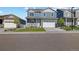 Beautiful two-story home featuring a manicured lawn and an inviting porch at 2144 Rosette Ln, Castle Rock, CO 80104