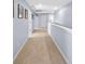 Hallway with neutral carpeting leading to various rooms, promoting easy navigation throughout the home at 2144 Rosette Ln, Castle Rock, CO 80104