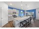 Stylish kitchen featuring a granite island with seating, modern appliances, and a dining area perfect for entertaining at 2144 Rosette Ln, Castle Rock, CO 80104