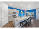 Stylish kitchen with gray cabinets, granite countertops, and a spacious island at 2144 Rosette Ln, Castle Rock, CO 80104