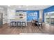 Open-concept kitchen and dining area with granite island, modern appliances, and a welcoming atmosphere for gatherings at 2144 Rosette Ln, Castle Rock, CO 80104