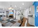 Open floor plan with living, dining, and kitchen featuring modern finishes and natural light for comfortable living at 2144 Rosette Ln, Castle Rock, CO 80104