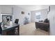 Bright home office featuring a desk, a comfy chair, and a window with neighborhood views at 2144 Rosette Ln, Castle Rock, CO 80104