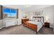 Bright bedroom with wood bed frame, city view, and ample closet space at 1196 N Grant St # 710, Denver, CO 80203