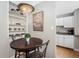 Small dining area with kitchen access and built-in shelving at 1196 N Grant St # 710, Denver, CO 80203