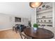 Small dining area with kitchen access and built-in shelving at 1196 N Grant St # 710, Denver, CO 80203