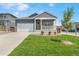 Inviting home with a landscaped front yard, a two-car garage, and an attractive stone and siding facade at 4530 Cattle Cross Trl, Castle Rock, CO 80104