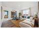 Bright living room with a comfortable sectional sofa, large TV, and a sunny window at 4530 Cattle Cross Trl, Castle Rock, CO 80104