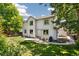 A spacious backyard featuring a patio area with outdoor furniture and lush green grass, perfect for relaxation at 13439 Antlers St, Broomfield, CO 80020