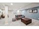 Cozy finished basement with a gray couch, chest table and neutral carpet perfect for entertaining at 13439 Antlers St, Broomfield, CO 80020