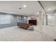 Finished basement with neutral carpeting and accent wall, great for entertaining and relaxing at 13439 Antlers St, Broomfield, CO 80020
