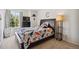 A cozy bedroom features warm tones, a comfortable bed, and playful dinosaur decorations at 13439 Antlers St, Broomfield, CO 80020