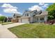 Inviting two-story home featuring a well-manicured lawn and a three-car garage at 13439 Antlers St, Broomfield, CO 80020