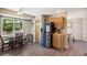 Cozy kitchen with stainless steel refrigerator and window with a view of green backyard at 13439 Antlers St, Broomfield, CO 80020