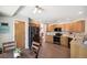 Charming kitchen features stainless steel appliances, granite countertops, and beautiful wood flooring at 13439 Antlers St, Broomfield, CO 80020