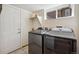 Bright laundry room featuring tile floor and modern washer and dryer at 13439 Antlers St, Broomfield, CO 80020