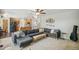 Living room and kitchen with an open floorplan, with cozy furnishings, decor, and adjacent staircase at 13439 Antlers St, Broomfield, CO 80020