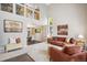 Cozy living room with high ceilings, modern decor, and an open view to the dining area at 13439 Antlers St, Broomfield, CO 80020