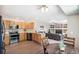 This kitchen has an open floorplan into a living room with a fireplace and mounted television at 13439 Antlers St, Broomfield, CO 80020