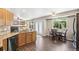 Open floorplan from kitchen into living room featuring backyard access and stainless steel dishwasher at 13439 Antlers St, Broomfield, CO 80020
