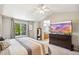 A peaceful main bedroom features natural light, and a television for relaxing evenings at 13439 Antlers St, Broomfield, CO 80020
